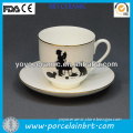 white porcelain modern coffe cups and plate
